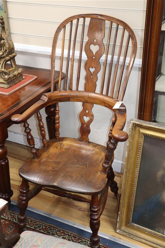 A harlequin set of six Victorian heart motif yew and elm Windsor chairs